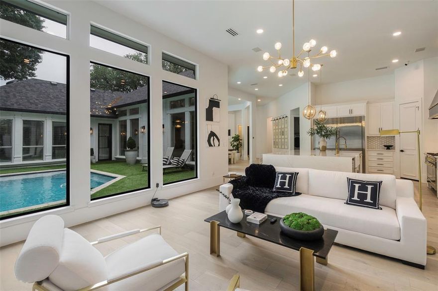 Private Gated Lock-and-Leave Residence in Preston Hollow

Reconstructed from the studs in 2023, this refined single-story home offers turnkey luxury within an intimate gated enclave of just four residences. Designed for effortless ownership, the property blends modern architectural character with privacy and security in one of Dallas’ most established luxury neighborhoods.

Expansive picture windows frame views of the pool and fill the interiors with natural light, enhancing the open, intentional flow of the living spaces. Engineered white oak flooring extends throughout, complemented by oversized black iron doors that create a striking design statement. Major updates completed during the reconstruction include a new roof, HVAC systems, and updated ductwork.

The private primary suite overlooks the pool and features a spa-inspired bath with heated Thassos marble floors and a boutique-style custom closet with integrated lighting. At the center of the home, the kitchen anchors the space with a waterfall quartz island, professional-grade range, and built-in refrigeration.

The homeowners association maintains the grounds and provides gated security for this discreet collection of residences, offering true lock-and-leave convenience. Just moments from Central Market and premier neighborhood destinations, the location delivers both prestige and everyday accessibility.

A rare opportunity to own a modern gated retreat in the heart of Preston Hollow.