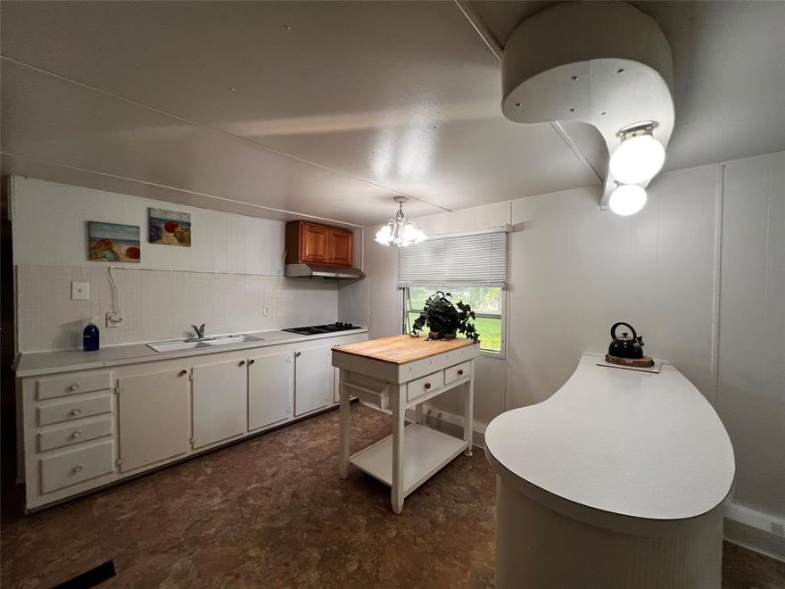 Well maintained and updated home with 3 bedrooms, spacious living and dining room! It is perfect for weekend retreat or full-time home. Two houses away from the beautiful sandy beach at Lake Texoma. Screened porch provides a lovely sheltered outdoor living center. Fenced yard with gate. Take action and start your life at the lake! Home is clean and move-in ready!