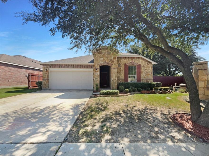 Welcome to this beautifully updated home! The living room boasts a cozy fireplace and a neutral color paint scheme, providing a warm and inviting atmosphere. The kitchen is a chef's dream with a center island, accent backsplash, and all stainless steel appliances. The primary bedroom features a walk-in closet, and the primary bathroom offers double sinks and a separate tub and shower for ultimate relaxation. Fresh interior paint and partial flooring replacement add a modern touch to this charming home. Outside, you'll find a covered patio perfect for entertaining. This home is a must-see! This home is a must-see! This home has been virtually staged to illustrate its potential.Home comes with a 100-Day Home Warranty and a 7-Day Home Test Drive to move in 7 days early for free.