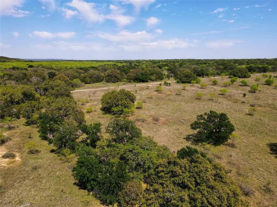 This unique property offers a rare combination of mature trees and wide-open space—ideal for building your dream home or private retreat. Enjoy breathtaking panoramic views of the Palo Pinto Mountains, an abundance of wildlife, and exclusive access to a private park along the scenic Brazos River. With no HOA, you’ll have the freedom to make the space your own, while continued membership in the local grazing association keeps the AG exemption in place. No mobile homes allowed ensures long-term property value and neighborhood integrity. Whether you're looking for tranquility, recreation, or a place to plant roots, this lot checks all the boxes.