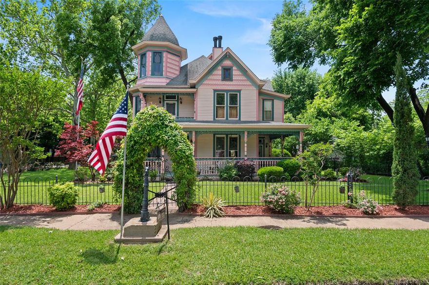 Immerse yourself in the lively Waxahachie parades from the expansive front patio or balcony, surrounded by your favorite companions. This historic single-family home, situated in the heart of the West End Historic District, had a complete roof replacement in June 2025. 
The Queen Anne-style Victorian home, built in 1891, beautifully merges vintage charm with contemporary comforts. The exterior showcases intricate Victorian architecture, featuring ornate woodwork and an inviting front porch that invites you to step back in time. 
The Interior of the home has the lushes high ceilings, original hardwood floors, three pocket doors, large windows that bathe each room in natural light. Each fireplace is fitted with gas logs for warmth and ambiance. The spacious bedrooms provide cozy retreats, each exuding its own unique character. The master suite boasts a luxurious bathroom complete with a clawfoot tub, perfect for relaxing after a long day. 
The distinctive third-floor turret further enhances the home's architectural appeal. 
The backyard is beautifully landscaped and offers an ideal space for entertaining or enjoying a morning sunrise. 
An RV space provides complete hookups adding conveniences for travelers or guests. 
This property not only embodies a piece of history, but also immerses you in a vibrant community atmosphere, with local shops, cafes, and parks just a short stroll away.