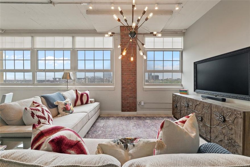 Perched on the 4th floor with the best panoramic view of downtown Fort Worth from the living room, dining room and primary bedroom, this stylish condo offers the ultimate in luxurious urban living. A light-filled open floor plan welcomes you with fresh designer paint and lighting, and sleek finishes that elevate everyday living. Includes the coveted two side-by-side assigned parking spaces and the peace of mind that comes with 24-hour concierge service. The amenity-rich building features a sparkling resort-style pool, state-of-the-art fitness center, media-movie theater, and secure covered access. Whether you're entertaining guests or enjoying a quiet evening with the city lights as your backdrop, this condo is designed for both comfort and wow-factor. Walkable to restaurants, shopping, and nightlife—this is downtown living at its finest.