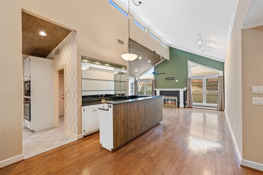 Tucked away in the desirable Ridgerock Court community, this charming 2-bedroom, 2-bath garden home offers the perfect blend of comfort, character, and low-maintenance living. From the moment you step inside, the inviting living room captures your attention with its soaring vaulted wood-plank ceiling, transom windows, and an abundance of natural light that creates a warm and welcoming atmosphere. A cozy wood-burning fireplace and convenient wet bar make this space ideal for both relaxing evenings and effortless entertaining. The spacious dining area flows seamlessly into the kitchen, where the home chef will appreciate abundant cabinetry, generous counter space, an electric cooktop, built-in microwave and oven, and plenty of storage. The private primary suite offers a peaceful retreat with an updated ensuite bath featuring dual sinks, a large walk-in shower, and a spacious walk-in closet. One of the home’s most special features is the beautiful garden room—an inviting space to unwind while enjoying views of the tranquil outdoor setting. Step outside to your private outdoor area, perfect for morning coffee, quiet afternoons, or evening gatherings. A rear-entry two-car garage adds both privacy and additional storage. With its thoughtful layout, charming architectural details, and relaxing indoor-outdoor living spaces, this delightful home is ready to impress. Schedule your private showing today and experience everything this Ridgerock Court gem has to offer.