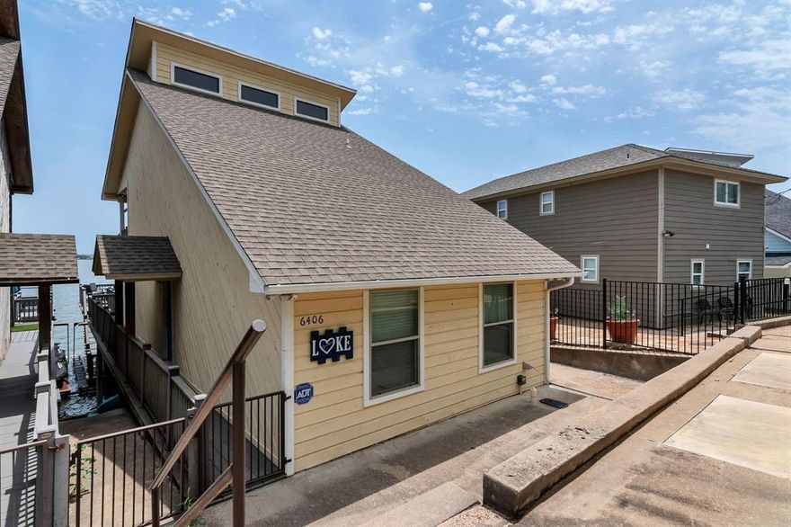 Experience Lakefront Living at Its Finest!
This one of a kind Lake Chalet is perfectly perched on deep main body water, offering stunning panoramic views, which are some of the very best in all of Granbury. Whether you're searching for a full time residence, weekend escape, or income producing vacation rental, this turnkey property has it all.

Enjoy upscale touches throughout, including granite countertops, stainless steel appliances, automated window shades, and an electric awning on the spacious main-level deck—ideal for relaxing or entertaining. The ground floor features an open-concept kitchen, dining, and living area, plus a bedroom, full bath, laundry room, and access to the largest deck in the home.

Upstairs, the private primary retreat opens to your own lakefront balcony, along with an ensuite bath with double vanities. The lower level includes a third bedroom perfect as a guest room, office, or flex space alongside a private boat dock with an updated boat lift and two jet ski lifts.

And here's the rare bonus: this is the only chalet in the community with a fully enclosed 2 car garage. There's even a beautiful boat available for purchase to complete the package!

Don’t miss this rare opportunity to own a slice of lakefront paradise.