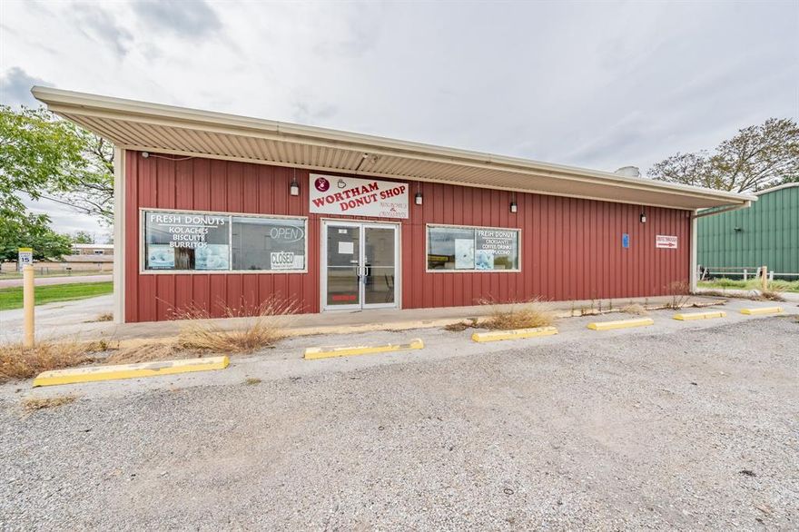 Endless possibilities for this amazing property! Donut Shop, Tire Shop, BBQ Restaurant, etc.
Nestled in the heart of Wortham, this location on Highway 14 offers exceptional visibility, thanks to a constant flow of traffic and its proximity to a nearby school. The highly regarded Wortham Donut Shop has been serving its loyal clientele for over a decade, establishing an impressive track record of success.

This property features a low-maintenance metal building, complete with office and storage space, along with a convenient bathroom featuring a shower stall. An additional storage building is situated outdoors, and there's an abundance of parking space, as well as a drive-through for added convenience. The icing on the cake is that everything required to start your business immediately is included.

Seller is willing to lease property and also willing to do owner finance.