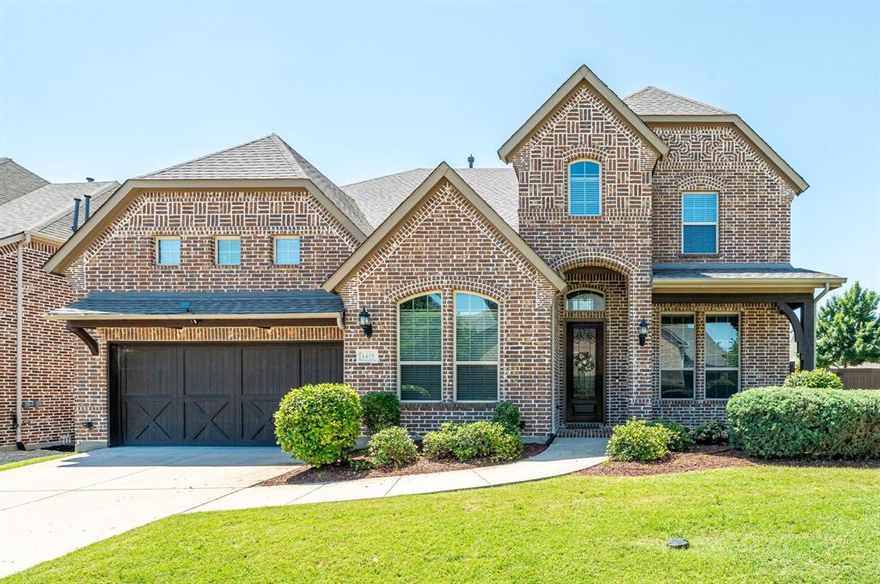Exceptional in every sense, this beautifully crafted custom home in the prestigious Wynn Ridge Estates within McKinney's award-winning Stonebridge Ranch community delivers a living experience unlike any other. Rich hardwood flooring, soaring ceilings, and designer lighting set an elegant tone from the moment you step inside. What truly sets this home apart is the rare layout featuring both the primary suite and a secondary bedroom with a full bath on the main floor, offering incredible flexibility for guests, multigenerational living, or the ease of single-level living. The open-concept kitchen is the heart of the home with white cabinetry, granite countertops, gas cooktop with griddle, and a generous stained island perfect for gathering. A walk-in pantry, Butler’s pantry, and seamlessly connected dining room make entertaining effortless. The living area is anchored by a striking floor-to-ceiling stone fireplace and a wall of windows that fill the space with natural light. The primary suite is a true retreat with bay windows, dual walk-in closets, a garden tub, and an oversized shower. Upstairs features a spacious game room, media room, half bath, and two bedrooms, each with en suite bath and walk-in closets, offering room for everyone to spread out and settle in comfortably. Step outside to a screened porch that opens for an outdoor living experience with brick flooring overlooking an oversized backyard shaded by beautiful magnolia trees. Additional highlights include a 3-car tandem garage with epoxy flooring, mudroom bench, double-pane windows, water treatment system with microbiological filtered drinking water, water softener, fresh paint, 2026 roof, 2025 HVAC systems, and a 2023 water heater. Just minutes from parks, shopping, and dining, Stonebridge Ranch living offers resort-style pools, tennis, pickle ball, and clubhouse amenities, along with golf cart access to both country clubs, Adriatica Village and Westgrove shopping and dining.