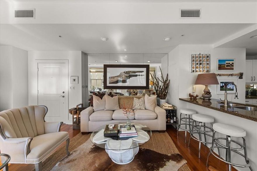 Unit 501 isn’t just a home — it’s a quiet love story unfolding high above the heartbeat of Fort Worth. From the moment you step inside, the city seems to lean in close, whispering through tall windows that spill golden light across the hardwood floors. This is the kind of place where you can relax on the patio for a slow morning and where the nights come alive.

The open-concept living area doesn’t simply welcome you — it embraces you, drawing your eyes outward through the large windows to overlook the pool and the sound of running water. Sunsets linger longer here, brushing warm color across the rooms.

The bedroom is a retreat, an exhale — soft, serene, and perfectly tucked away. It’s the space where you’ll keep rediscovering the peace you didn’t realize you were missing. The bathroom, polished and calm, completes the suite with intention.

Set in one of Fort Worth’s beloved historic buildings, Unit 501 blends timeless character with contemporary comfort. This unit also comes with a parking space AND large basement storage (15x7). Step outside and downtown greets you with dining, arts, and energy.