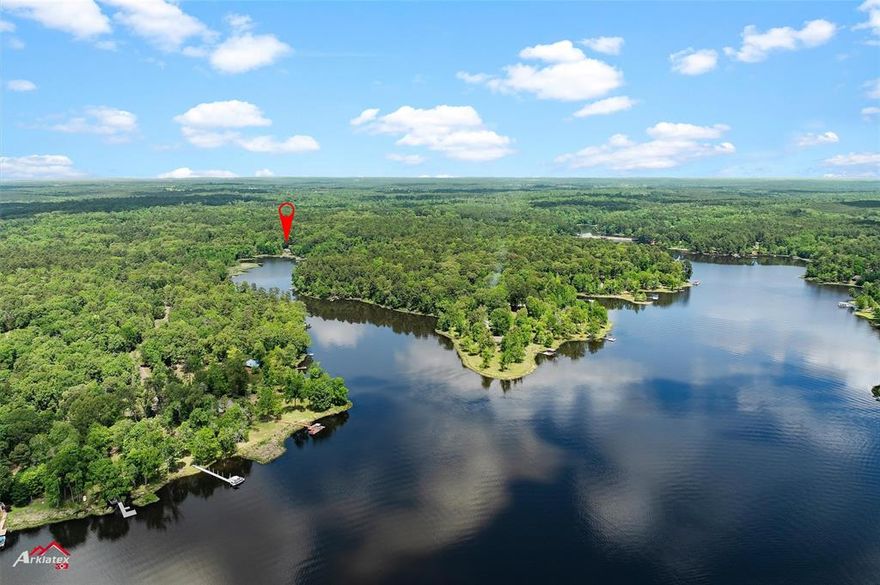 Looking for tranquility on the Lake???? Look no further!!!! This beautiful waterfront home is situated in the private Eagle
Landing subdivision and sits on 1 acre that is immaculately landscaped. This home boasts a beautiful open floor plan with a
custom fireplace and an oversized living area that steps into a fabulous sunroom filled with large windows for lake viewing all
through the year. It has 2 master en-suites that boasts beautiful tile flooring, walk in closets, oversized windows that are facing
the lake. The home has been reconstructed to accompany a large third bedroom and the bonus room could make a fourth
bedroom if needed. There is a chifforobe that will stay that could serve as closet space and for extra clothes storage, there is a
large customized cedar closet for extra storage inside the garage. The backyard features a deck with a covered patio beside it
for outdoor cooking and grilling. The storage building is wired with electricity and can be used to store yard equipment and is
large enough to be used as a workshop. There is a wonderful dock that has been freshly painted to fish off of or just sit and
enjoy watching the sunset. This home is perfect for entertaining guests with plenty of space inside and out! It is situated in just
the right spot for a gorgeous view of the lake and is a must see with all of its flexibility and spaciousness and has many
features that make it economical and keeps the utilities at a minimum! Don't wait, call today for your private showing!