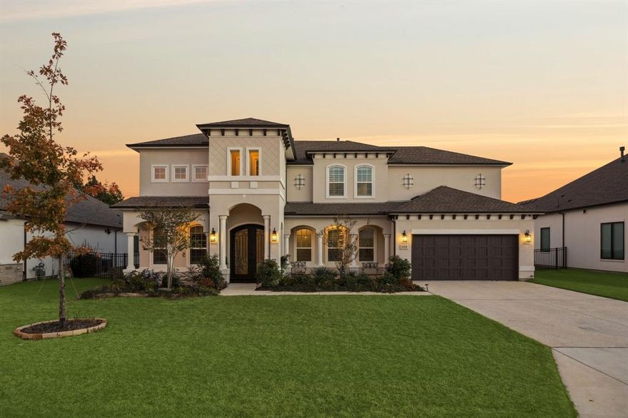 Backing to the shimmering shores of Lake Lewisville, this extraordinary estate blends timeless elegance w-modern luxury. A striking stucco façade w-double front porches sets the tone, while the expansive backyard, complete w-an extended covered patio & endless space for a future resort-style pool, creates the perfect backdrop for lakeside living. Inside, a dramatic grand entry & winding wood staircase w-designer iron rails make a breathtaking first impression. Private study anchors the front of the home, while an impressive formal dining room offers the ideal setting for elevated entertaining. Light-filled living room is truly grand, boasting full glass sliders that open to the outdoors & a soaring, upgraded fireplace that defines the space. The showstopping Chef’s Kitchen is a work of art, showcasing JennAir apps, a waterfall-edge island, custom cabinetry to the ceiling w-glass displays, upgraded drawers & hardware, butler’s pantry + an extended breakfast nook overlooking the backyard. The main level features 2 beautifully appointed guest suites + an extended primary retreat offering custom closets + a spa-caliber bath w-upgraded tile, a frameless glass shower & a luxurious soaking tub. Upstairs, leisure & indulgence take center stage w-an expansive game room & a fully outfitted private cinema, complete w-130-inch screen, Sony projector & an immersive Bowers & Wilkins 12-speaker Dolby Atmos system. Designer upgrades elevate every corner, wood flooring, premium carpet padding, upgraded lighting, staircase illumination, custom mud bench cabinetry & premium finishes throughout. Smart-home enhancements abound, including whole-home water softening & RO systems, automated Lutron lighting, motorized shades & shutters, B&W speakers in multiple rooms, Yale smart locks, security cameras, upgraded garage flooring + a 60W electric car charger. Every detail has been meticulously curated to deliver unmatched luxury in a breathtaking lakefront retreat that is truly one of a kind.