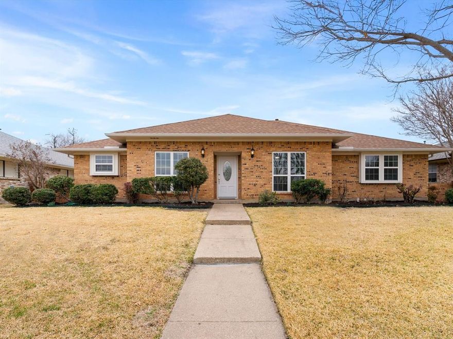 Beautifully renovated custom built 4-bedroom home in Carrollton’s High Country neighborhood, thoughtful updates and a flexible floor plan make everyday living and entertaining effortless.  Major upgrades include complete replacement of all cast iron plumbing and the clean-out with modern PVC plumbing, HVAC system complete replacement (2025), water heater replaced, plus numerous other recent improvements and modern updates that make this home move-in ready.  A white brick fireplace anchors the spacious main living area and creates a bright, modern focal point, complemented by tall ceilings.  Throughout the home, fresh paint, updated flooring, and thoughtful finishes contribute to a cohesive style.  The remodeled kitchen features stainless steel appliances, quartz countertops, backsplash and ample storage, making meal prep stylish, fun and functional. The breakfast nook offers a built-in china cabinet for added storage and display space.  The primary bedroom boasts a large ensuite bathroom with dual closets for abundant storage space, dual quartz vanities, dual sinks and a fully renovated glass enclosed walk-in shower. The second full bathroom is equally updated with dual sinks, quartz counters, and a refinished tub-shower.  Updated windows provide ample natural light and energy efficiency.  The two-car garage provides an option to convert a portion into a private office or hobby space with electrical and a vent already in place.  Outside, a covered patio overlooks the landscaped backyard, giving you a shaded spot to relax, grill, or gather.  Located in an established Carrollton community just minutes from top rated Carrollton-Farmers Branch open enrollment schools, highways, airports, restaurants, shopping and entertainment, this home supports an enjoyable lifestyle for years to come.  You'll love the home's location close to Carrollton's Blue Trail with walking paths, parks and ponds along the greenbelt.