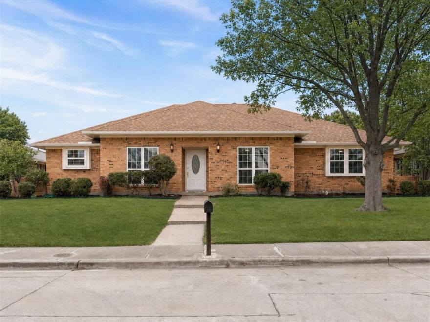 Step inside this beautifully renovated custom built 4-bedroom home in Carrollton’s High Country neighborhood, where thoughtful updates and a flexible floor plan make everyday living and entertaining effortless. Major upgrades include complete replacement of all cast iron plumbing and the clean-out with modern PVC plumbing, HVAC system complete replacement (2025), water heater replaced, plus numerous other recent improvements and modern updates that make this home move-in ready. A white brick fireplace anchors the spacious main living area and creates a bright, modern focal point, complemented by tall ceilings. Throughout the home, fresh paint, updated flooring, and thoughtful finishes contribute to a cohesive style. The remodeled kitchen features stainless steel appliances, quartz countertops, backsplash and ample storage, making meal prep stylish, fun and functional. The breakfast nook offers a built-in china cabinet for added storage and display space. The primary bedroom boasts a large ensuite bathroom with dual closets for abundant storage space, dual quartz vanities, dual sinks and a fully renovated glass enclosed walk-in shower. The second full bathroom is equally updated with dual sinks, quartz counters, and a refinished tub-shower. Updated windows provide ample natural light and energy efficiency. The two-car garage provides an option to convert a portion into a private office or hobby space with electrical and a vent already in place. Outside, a covered patio overlooks the landscaped backyard, giving you a shaded spot to relax, grill, or gather. Located in an established Carrollton community just minutes from top rated Carrollton-Farmers Branch open enrollment schools, highways, airports, restaurants, shopping and entertainment, this home supports an enjoyable lifestyle for years to come. You'll love the home's location close to Carrollton's Blue Trail with walking paths, parks and ponds along the greenbelt.