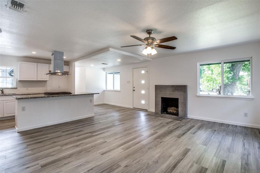 WELCOME HOME! Move in ready single story and ZHS impeccably renovated. Lots of designer touches with luxurious vinyl plank flooring and trending colors. Enjoy entertaining in your upgraaded open concept style kitchen with shaker cabinets, gorgeous Granite counter tops, subway tile backsplash, and newer appliances. You will love cooking on your gas cooktop range! Escape to your large master suite after a long day complete with spacious walk in shower and spacious vanity. Huge back yard and large patio, including the back end of a Chevy pickup that was repurposed as a flower garden. The one car garage was converted into a new master suite. Great floor plan and one I'm sure you will fall in love with...MUST SEE!!  IMMEDIATE MOVE IN AVAILABLE!!