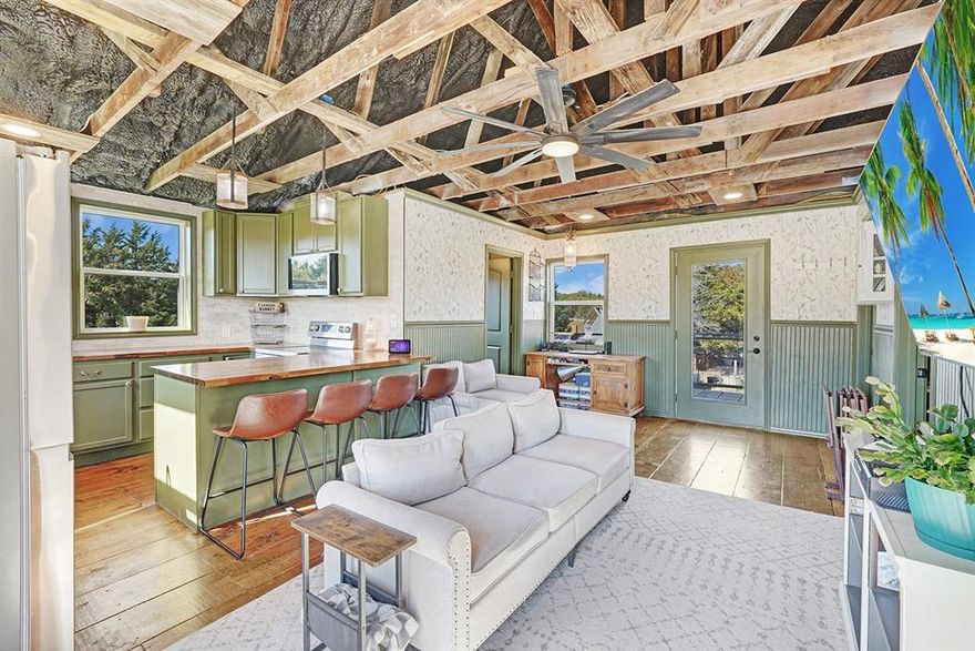 Use of Preferred  Lender will offer to pay .75 points of buyer’s closing costs. Call TODAY to see if you Qualify!
Unique Rustic Barndominium on Over 10 Acres! Discover the perfect blend of rustic charm and modern living in this stunning 2-bedroom, 1-bathroom situated on over 10 acres of breathtaking countryside. This property offers expansive views and ample space for relaxation, recreation, and work, making it a rare find. The spacious living areas feature exposed rafters that enhance the open feel, complemented by wide plank wood floors that add warmth and character. The gourmet kitchen boasts an open concept design that seamlessly flows into the living area, featuring butcher block countertops, a beautiful travertine backsplash, and a farmhouse sink with stunning views of the land. It comes equipped with stainless steel appliances and bar seating for casual dining. The master suite is thoughtfully located at the back of the home for added privacy and includes a private entrance into the rustic glam bathroom with double sinks on a repurposed dresser, elegant gold accent mirrors, and a tiled shower and tub area. The second bedroom is designed with a custom closet system, offering versatile storage options. Outdoor living is equally impressive with an expansive back deck, perfect for hosting gatherings or enjoying tranquil sunsets. Beneath the house, there’s an open stable area ideal for animals or extra storage. The property is fully fenced and cross-fenced, featuring an RV hookup complete with water, sewage, and electricity, along with a built patio for convenience. Additionally, a designated garden area includes a greenhouse and a fenced space ready for your gardening projects.Don’t miss this incredible opportunity to own a piece of paradise! Whether you’re looking for a serene retreat or an active lifestyle, this Barndominium has it all.