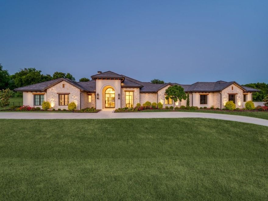 Exquisite estate set amidst two meticulously manicured, tree-lined acres. This entertainer's dream blends refined craftsmanship with luxury living, making it one of the most exceptional properties in North Texas. Showcasing a stunning contemporary luxury design, the home features rich wood beams and white oak floors throughout. The spacious family room, framed by a wall of windows, provides tranquil views of the backyard oasis. The gourmet kitchen is a culinary masterpiece, boasting Carrara marble countertops, a Sub-Zero refrigerator and wine cooler, Wolf gas range, built-in Miele coffee maker and a discrete and fully equipped prep kitchen. The kitchen opens seamlessly to the grand family room, anchored by an elegant fireplace perfect for gatherings and everyday living. A large game room with a wet bar, along with a dedicated exercise room and media room with concealed door entry, provide space for recreation and wellness. The private master retreat offers serene views of the pool and features luxurious marble flooring and walls, dual vanities, towel warmer, heated flooring, a soaking tub, a spacious double walk in shower, and an extraordinary custom closet complete with built in vanity and tornado shelter. Each secondary bedroom is oversized, featuring its own ensuite bath and walk-in closet. Executive office featuring custom built ins complete with unique private ventilated cigar room. Oversized laundry room with two double stack washers and dryers and dog washing station with convenient entry to dog run. Step outside to your resort style backyard, complete with a sparkling pool, spa, outdoor living area with fireplace, kitchen, dining area and fire pit- ideal for relaxing or entertaining guests in a peaceful, secluded setting. Additional highlights include a 5 car garage with extra storage space, gated motor court, and a prime location just minutes from restaurants, shopping and Highway 75. Located within the highly acclaimed Lovejoy ISD.