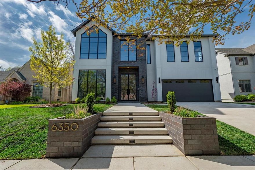 Welcome to 6350 McCommas Blvd, stunning new construction by Bressler Design + Build with interior design by Alejandra Mora of CH Design studio. This custom designed home offers five bedrooms, 5 full bathrooms with 2 powder baths, upstairs primary, formal office, upstairs game room, and a spacious, open floor plan. The first floor is comprised of an open concept kitchen with an attached butlers pantry with additional refrigerator, living room and open dining room off the kitchen, a second primary suite at the rear, and an incredible private office with beautiful pocket doors. Upstairs you will find the open concept living room with three additional bedrooms with attached baths as well as the primary at the year. The backyard boasts a beautiful covered patio with built in grill and beverage fridge, the perfect spot to relax and watch the game. The 10ft privacy fence make this oversized backyard an amazing place to entertain and play.
