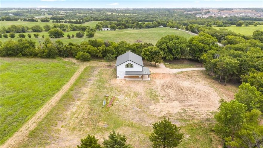 MIRACLES DO HAPPEN!! RARELY do you find a beautiful build site already prepped for you! Secluded 5+acres on a private road with pond and trees and privacy! All this and a TWO STORY SHOP built like FORT KNOX!! You think I am exaggerating but when you see it you will be amazed. It is a red iron barn or shop with closed cell foam on all walls and ceiling and additional open cell foam on ceiling. Two walk in doors, 3 insulated garage doors; 8W by10H, 10W by10H, and 12W by 14H and belled pier foundation with significant rebar reinforcement.  40W by 60L with 36 foot peak height with rail gutters all the way around. Ready for you to build the home of your dreams! Click on Virtual Tour then click on YouTube for wonderful video of this lovely property.