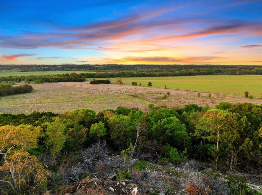 RARE and truly stunning, this 4.51 acre property presents an exceptional opportunity to create a one-of-a-kind custom residence in a breathtaking setting. Positioned on an elevated homesite with sweeping 180-degree views, this property offers the perfect canvas to design and build a home that captures both scale and serenity.
The setting is nothing short of remarkable—wide open skies, natural beauty, and a sense of privacy that feels worlds away, yet remains easily accessible. Every angle of this property was made to be experienced, offering an ideal backdrop for a thoughtfully designed home that embraces indoor-outdoor living and maximizes the surrounding views.
Surrounded by peaceful countryside and abundant wildlife, the property delivers a refined take on country living, complemented by the convenience of a paved county road.
Ideally located just 15 minutes from Waco and approximately 1.5 hours from both Dallas-Fort Worth and Austin, this is a rare opportunity to secure an elevated homesite in a truly exceptional location.
This is more than land—it is the foundation for something exceptional.