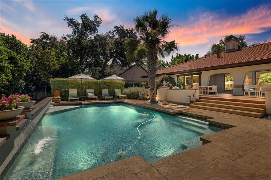 Resort-Style Estate Backing to Preston Trail Golf Course – Exceptional one-story Bent Tree estate on a rare 0.5-acre lot with golf course frontage. This fully updated property includes a 3,764 SF main home and a 1,140 SF cabana-style guesthouse (built 2016), blending timeless Spanish Colonial design with luxurious modern finishes.

Arched openings, wood-beamed ceilings, Saltillo tile, and new hickory engineered hardwoods set the tone. The chef’s kitchen features Ann Sacks tile, Basaltina lava stone countertops, farm sink, and SubZero refrigerator (2022). The primary suite, renovated in 2024, boasts a spa-worthy bath, custom closets, and remote-control shades.

Ideal for entertaining—media room with 3LCD projector and drop-down screen, wet bar with leathered granite, Sonic ice machine, and glass shelving. Recent upgrades include new HVACs (2024), retiled spa (2024), pool stucco (2023), whole-house Generac generator (2023), updated powder and utility rooms, fresh garage paint, art and landscape lighting, and exterior cameras.

Resort-inspired outdoor living offers a pool with tanning ledge, sheer descent waterfalls, spa, and spacious cabana guesthouse with full kitchen, living area, and bath. Minutes from Trinity Christian Academy and major conveniences, this turnkey golf course retreat is one of Bent Tree’s finest.