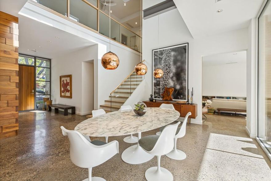 Welcome home to this stunning mid-century modern nestled on a picturesque .99 acres, built by Holmes Builder. As you enter, you’re greeted by walls of glass offering breathtaking views of the manicured grounds. Thoughtfully designed with an open floor plan, the home offers multiple living areas, first floor media, study, game room, bonus room, and a three-car garage. This home has ample indoor and outdoor living space with emphasis on entertaining. The one-of-a-kind chef's kitchen is outfit with professional grade Wolf & SubZero appliances, and Imported from Italy Arclinea stainless steel island. The open views throughout the kitchen, dining, and main living space are breathtaking and truly capture the modern elegance of this home. Luxury Primary Suite & bath with oversized bedrooms throughout. Upstairs is complete with additional living room and recreation room. Beautiful pool & hot tub overlooks entire property. Fire pit, covered outdoor kitchen, tornado shelter & more. A must see!