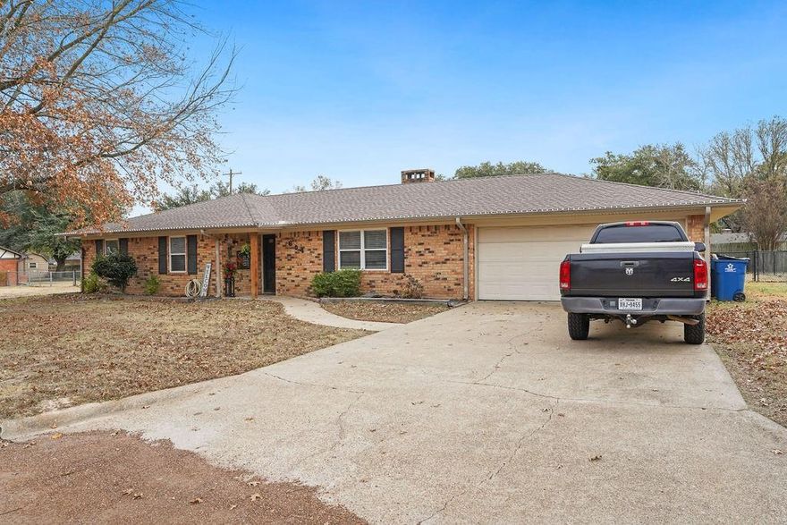 Welcome home to this charming and well-loved ranch that blends classic comfort with modern updates. Set on a level lot with a brick exterior, this home features a newer roof, a fully fenced backyard, and a cozy firepit that is perfect for evenings under the stars. Inside, natural wood accents add warmth throughout, while the living room offers a wood-burning fireplace and ceiling fan for year-round comfort. The eat-in kitchen shines with an on-trend color palette, butcher block countertops, subway tile backsplash, and newer appliances. A spacious laundry room with sink and extra storage adds everyday convenience. All bedrooms include ceiling fans, and the updated bathrooms feature stylish finishes and modern mirrors. Enjoy outdoor living on the covered back patio with ceiling fan is an ideal spot to relax or entertain. Quaint, updated, and move-in ready!