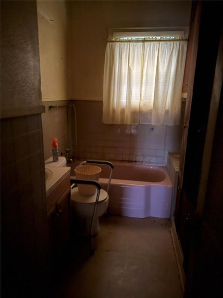 . Nice Vinyl siding on exterior of house. Updated Windows, Has 3 bedrooms and 2 full baths, the Master Bedroom is huge!!! the other 2 bedrooms are also large. Located in a quite  block. Will make a great  rental property. Please wear a mask when entering the house. Mold present in the Kitchen and back Bedroom from roof needing repairs.