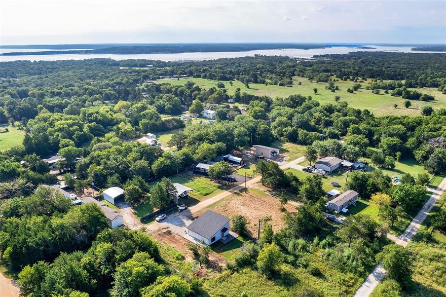 Fantastic opportunity near Lake Texoma! This property includes three adjoining lots, offering ample space to build your dream home, weekend getaway, or investment property. Located just minutes from the lake, enjoy quick access to boating, fishing, and outdoor recreation. The lots are cleared, level and offer utilities available close by. Water tap fee has already been paid. Peaceful setting with trees at the back of the property and plenty of room to spread out. Conveniently located minutes away from Pelican Landing, Cedar Mills Marina and  Rock Creek Resort. Don't miss this versatile property in a growing lakeside community!