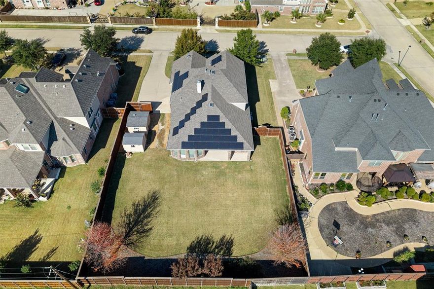 Space for everyone, storage for everything, and the kind of layout that just makes life easier! This beautifully updated home sits on an OVERSIZED one-third acre lot and includes PAID-OFF solar panels for low energy bills! The long side driveway, 12' double gate, and 8' board-on-board fence offer perfect side yard access for boat or trailer parking. The backyard features a 10x12 insulated workshop on slab with power and wall AC, an 8x10 storage shed, a large Covered Patio, AND a huge grassy yard with room to play or add a pool! Inside, enjoy brand-new light and bright interior paint, a private front Office with double doors, and a flexible formal Dining Room that can serve as a second office, playroom, or hobby room. The Kitchen offers granite counters, a large island, under-cabinet lighting, stainless steel appliances with new dishwasher, 5-burner gas cooktop, and a built-in tech center—overlooking the Living Room with a cozy fireplace and backyard views. The floor plan is ideal with the Primary Suite PLUS an additional Bedroom and full Bath on the first level; the Primary Bathroom includes split vanities, soaking tub, large walk-in shower, and massive closet! Upstairs you’ll find a spacious Game Room, a step-up Media Room with pre-wiring, additional Bedrooms and a full Bath, and multiple attic access points—including one with a walk-in door leading to extensive decked storage! An oversized garage with extra storage and a new WiFi-enabled opener completes this rare find. This home delivers the perfect blend of function, flexibility, and hard-to-find lot size with incredible bonus features and energy efficiency, including a new water heater! Fantastic location near Sachse High School, Heritage Park sports fields, The Station and Firewheel Town Center for dining and retail, and easy access to George Bush Turnpike and Lake Ray Hubbard!