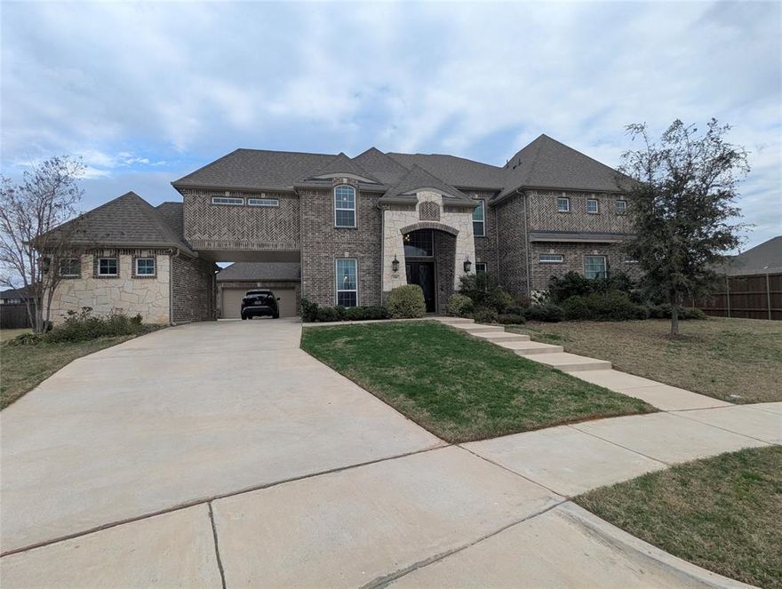 This stunning 6-bedroom, 4.5-bath home sits on a sprawling ¾-acre lot, complete with a backyard oasis featuring a luxurious pool and spa with a cascading waterfall and tanning shelf. As you pass through the porte-cochere, you’ll immediately notice the expansive parking area and the convenience of a split 3-car garage. The home’s curb appeal is undeniable, with elegant coach lights, a stone façade, and exquisite iron and glass front doors welcoming you inside. Step through the entryway into a bright, open floor plan, where an oversized dining room and durable wood-grained ceramic tile set the tone for modern elegance. The family room boasts a stunning floor-to-ceiling stone fireplace and offers gorgeous views of the expansive backyard and pool. A dream kitchen awaits any home chef, featuring a double oven, an upgraded 6-burner gas cooktop, and a California-style island topped with decorator granite. On the main floor, convenience is key with the primary suite, a guest bedroom, and a study all easily accessible without climbing stairs. Heading upstairs, you'll be captivated by the winding staircase adorned with intricate iron balusters and birdcage accents. The second floor offers an oversized game room—perfect for lounging or play—as well as a cozy media room ready for movie nights. Four additional bedrooms upstairs are thoughtfully arranged, complete with a mix of en-suite and Jack-and-Jill bathrooms for ultimate functionality. This home is located less than a mile from Lake Lewisville, offering plenty of opportunities for fishing, hiking, and outdoor activities. It truly offers the perfect blend of luxury, space, and thoughtful design, both inside and out.