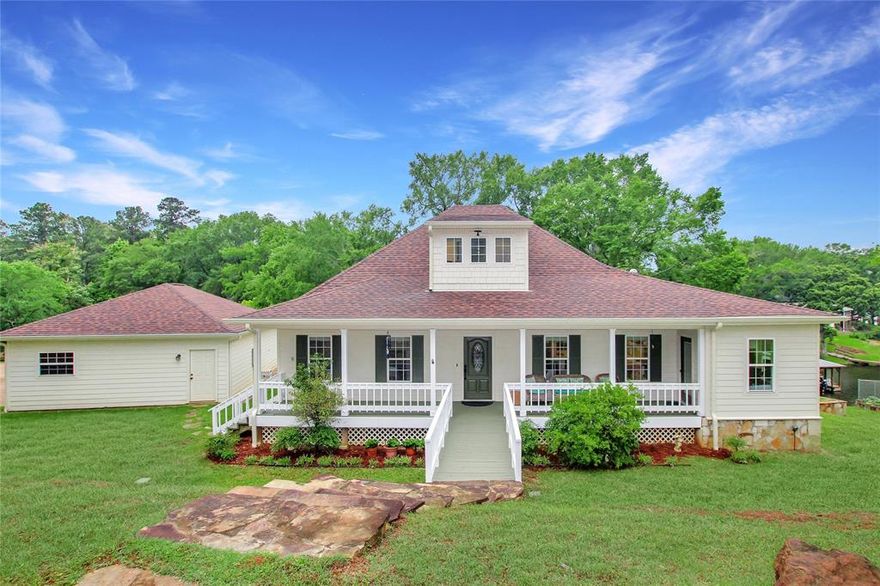 Welcome to this beautiful 3-bedroom, 3-bath waterfront home with a detached 2-car garage offering peaceful views of Lake Palestine! From the inviting front porch to the private boathouse and covered patio, this home is designed for comfort and relaxation. Inside, a spacious living area accommodates both living and formal dining, anchored by a double-sided gas log fireplace shared with the sunroom. Walls of windows bring in natural light and lake views. The kitchen features a large breakfast bar, gas cooktop, built-in oven and microwave, walk-in pantry, and additional food prep area with two vertical carousel pantries. There’s also space for a cozy dining nook. The sunroom offers panoramic lake views and shares the fireplace, creating a serene retreat. The utility room doubles as an office or hobby space with room for a second fridge. The primary suite includes a spacious bath with dual vanities, walk-in shower, soaking tub, and two walk-in closets. A guest bedroom downstairs has ensuite access to a full bath, while upstairs the third bedroom features a private bath and attic access—spray foam insulated in 2024. You also can't forget the three separate climate control systems that run within the house! Outside, enjoy the covered patio, fenced garden, and private boathouse with dock and sitting area. There is also an extensive irrigation system using water straight from the lake! A sea wall and retaining wall create a flat terrace along 254 feet of lake frontage. Updates include 2024 roof, gutters, covers, and a 2022 tankless water heater. The 1.2-acre property is deeded as three lots. The home and garage sit on two; the third lot (approx. 0.46 acres) offers potential for independent development. This peaceful lakefront home is ready for you!