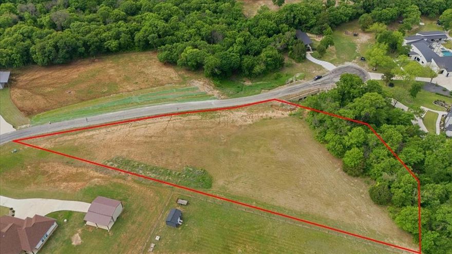 Gated neighborhood on acreage, close to everything! Here is your opportunity to have a treed lot in a gorgeous neighborhood! Just slightly over 2 acres, trees, septic, well. Build your custom home right here. No City Taxes. Great access to Fort Worth or Weatherford.