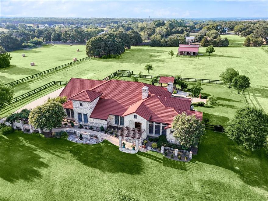 This stunning ag-exempt equestrian property is nestled on 4.7 acres in prestigious Bartonville, TX just a stone's throw from Liberty Christian School. This elegant home has 1 & a half stories with a spacious gameroom up. Those seeking versatility will love the home office w wood floors and the large den that could be a 2nd office, exercise room, or 5th bedroom. The heart of the home is the gourmet kitchen, featuring a stainless 6-burner gas stove with griddle, pot filler, & double ovens. The open design creates an inviting space for entertaining and the guest wing is thoughtfully separate from the rest of the house, offering privacy for guests or multi-generational living. Outside is the private oasis, complete with a gorgeous pool and spa featuring a swim-up bar, outdoor kitchen, & covered flagstone patio. Equestrians will love the 4-stall barn with feed & tack rooms, fans, automatic waterers and 3 runs. This home backs to equestrian trails, providing a seamless connection to nature.