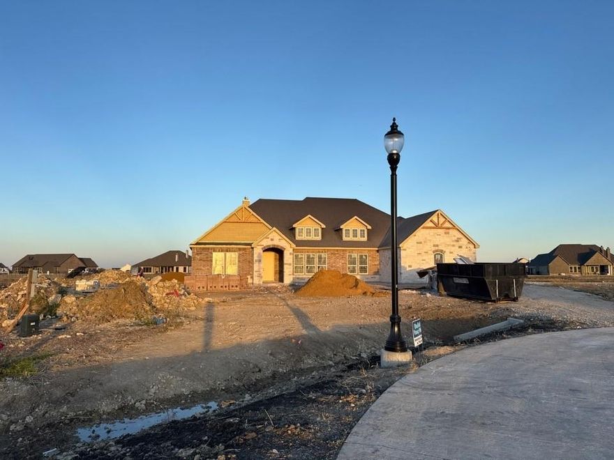 Estimated january 2026 completion! Ask us about our Trade In Trade Up program, we can buy your home! SPRAY FOAM ENCAPSULATED!  Discover the allure of the Foxglove plan, an epitome of sophistication and comfort crafted by Riverside Homebuilders. This luxurious one-story abode spans 3,497 square feet, offering 4 bedrooms and 3 bathrooms, meticulously designed for modern living. With a 3-car garage and a thoughtful layout, convenience and elegance seamlessly intertwine to create an unparalleled living experience. As you step through the front door, you're greeted by an open and airy foyer with wood look tile in the main areas, setting the tone for the home's inviting atmosphere. Off of the foyer, the luminous dining room awaits, perfect for hosting memorable gatherings with friends and family. Adjacent to the foyer, discover two versatile flex rooms, adaptable to your every need—whether it be a home gym, office or creative space. Continue through to the heart of the home, where the magic unfolds—a sprawling family room adorned with a cozy fireplace, nestled near a charming nook and a chef-inspired kitchen boasting ample counter space and storage areas. On one side of the home, three traditional bedrooms each feature a walk-in closet and are accompanied by two bathrooms for utmost convenience. For added entertainment, indulge in the media room, ensuring every member of the family has a space to fulfill their passions. On the opposite side, the owner's suite awaits, offering a sanctuary of luxury with top-quality features, a stunning owner's bath and an incredible walk-in closet. Lastly, step outside to the covered back patio with an outdoor fireplace, where you can bask in the gorgeous DFW weather and embrace outdoor living at its finest. In the Foxglove plan, luxury, convenience and versatility converge to create the perfect haven for modern living.