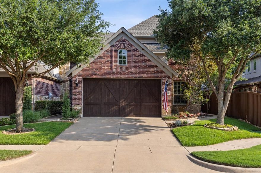 Elegant turn-key townhome in Prime West Plano location.End unit extra windows, light n bright open plan with dramatic ceilings & hand-scraped hardwoods in living areas.$35K premium lot backs to wooded area. Private flagstone patio with redwood arbor -relax & take advantage of views. Kitchen features white cabts,stone counters,breakfast bar,island,pantry & breakfast area.Utility room, half bath and garage conveniently nearby.Spacious Dining and Living Rooms overlook the back patio. Owner's retreat also shares the wooded views. Lux bath has jetted tub,sep shower,dual sinks,tons of storage and impressive walk-in closet!Upstairs checks all the boxes:Loft-Home Office,Game-Flex Room(wired for surround sound),huge stor closet,2 Bedrooms that share a full bath,2 linen closets.Plantation shuttlers throughout.Garage features double wood doors,epoxy floor& extra work area.Gated community pool,pavilion and fireplace & lovely park areas,front yard maintained by the HOA.