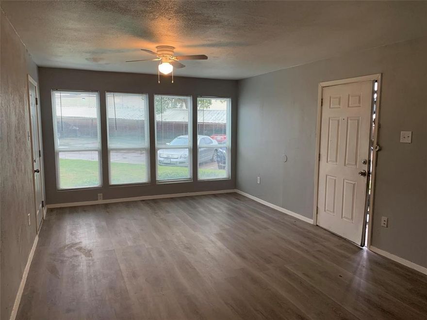 Second floor condo with Ceramic plank flooring in Kitchen, dining and bath, fresh carpet, interior wall paint. Living room has vaulted beam ceiling, Large bricked wood burning fireplace for cozy nights. Community pool. Close to Richland College, Dart line, shopping and Restaurants.