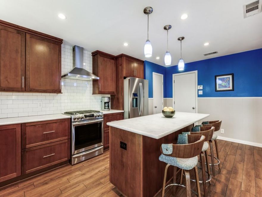 Renovated ranch sitting on a tree lined creek in East Dallas. Welcome to this beautifully updated, move-in-ready home. Major renovations have been completed, including a new roof installed prior to closing and fresh paint throughout.The heart of the home is the chef-inspired kitchen (2017) featuring Thomasville Custom Alder Hardwood Shaker Cabinets, Corian countertops, Pendant lights, Elkay Stainless Farmhouse Sink, and modern wood-like tile flooring. The space is equipped with stainless steel appliances, including a Samsung Gas 5-Burner Cookstove with Convection Oven and a stainless steel hood vent and LG Microwave installed in the island. Enjoy luxury and convenience in the recently renovated bathrooms. The Jack and Jill Bath (2024) is a standout with a custom black shaker vanity, quartz countertop, black and gold hardware,  tile shower enclosure with a glass door and a Bluetooth vent with lights and music. The Hall Bathroom (2021) features a blue tile shower enclosure with glass door, white shaker vanity, quartz countertop, and additional cabinetry for storage and floating shelves. Other features include: Oak Hardwood Floors, Recessed lighting, Rinaai Tankless Hot Water Heater (2015), Sewer Line Replacement (2015), formal dining area with a skylight, Walk-in Pantry and a dedicated laundry room with cabinets and shelving. The garage has tons of built in shelving and a workbench.  Exterior amenities include a wood deck overlooking the creek and backyard, established perennial landscaping, St. Augustine grass and sprinkler system. The French doors and Kitchen door lead out to the deck and backyard, connecting indoor and outdoor living.This home flawlessly blends classic charm with modern amenities. Excellent location with an appealing neighborhood vibe. 1 mile from White Rock Lake and just 6 miles from downtown. Nearby areas include Lakewood and Casa Linda for shopping and dining. Schedule a tour today!