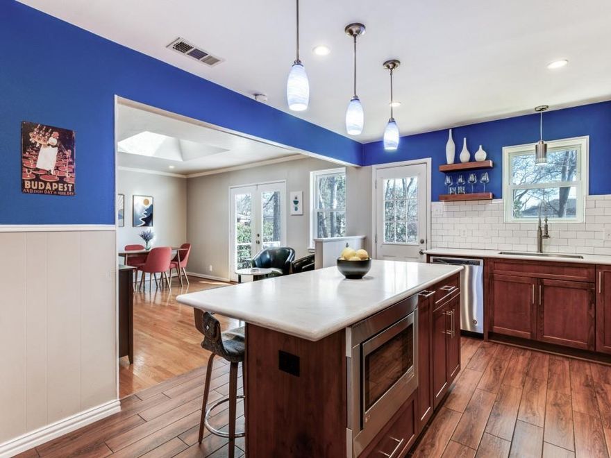 Renovated ranch sitting on a tree lined creek in an East Dallas neighborhood called Claremont. Excellent location with an appealing neighborhood vibe. 1 mile from White Rock Lake and just 6 miles from downtown.  A NEW ROOF will be installed before closing. The seller's have kept some of the original charm during the renovation including the Oak hardwoods and the Terrazzo floor in the entryway. The fully renovated bathrooms and custom built kitchen spared no expense on the details for functionality and style. There is a dedicated Utility room off of the kitchen and the rooms are generously sized. The garage has tons of built in shelving and a workbench.  The Dining room and kitchen overlook the backyard and both have access to the large cedar deck.  A perfect place to start or end your day.  This creek lot home has a lot going for it and so does the growing area.  There is a new EOS gym a short walk away and a park on St Francis that offers a dog park, skate park, tennis courts and playground. Check out the Ferguson Road Initiative website to see more exciting news about the area. For the outdoor enthusiasts,  the area connects to the new Trinity Forest Spine Trail off of Highland Rd that takes you to an 8 mile mountain biking trail and also connects you to White Rock Lake and through the Trinity Forest to the AT&T trail. Take a tour today.