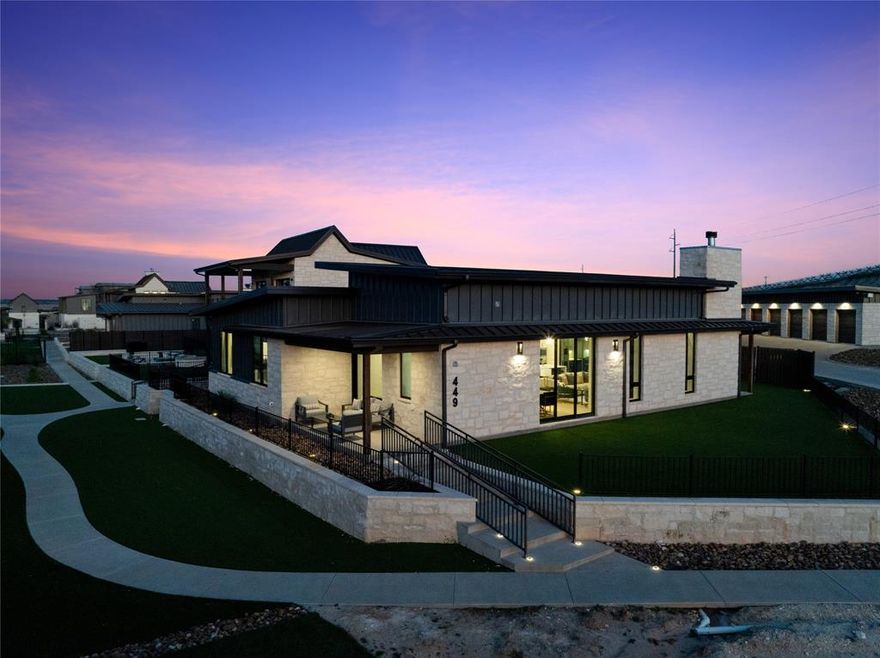 449 Emma Jean Trail is a beautifully appointed single-level residence within the exclusive, gated community of Rough Creek Lodge and Resort, offering 2,178 square feet of refined Hill Country living across 3 bedrooms and 3 full bathrooms. Buff limestone masonry, dark standing-seam metal roofing, and floor-to-ceiling glass create a striking modern exterior. Inside, soaring shiplap ceilings, wide-plank hardwood floors, and an open-concept layout set the tone for effortless entertaining. The chef's kitchen features a Sub-Zero refrigerator and professional Wolf range, paired with bold cobalt-blue cabinetry, white uppers, gold hardware, and a quartz waterfall island. A custom brass bar wall anchors the dining area, and the living space flows naturally to the covered patio, complete with an outdoor fireplace and mounted TV for year-round use. Two main bedrooms each with their own en suite bath, plus a custom bunk room featuring queen-over-twin bunks and a shared hallway bath. The lot is one of the community's largest private green spaces, connecting directly to the pickleball court. Ownership at Rough Creek unlocks 9,000 gated acres of Texas Hill Country adventure, including private fishing lakes, owner-only experiences, guided bird hunts, Beretta Room privileges, zip line, climbing wall, horseback riding, sporting clays, a 1,000-yard rifle range, award-winning dining, wellness services including massages and facials, and a supervised Kids' Ranch. Concierge-level HOA services and full-time on-site support make ownership as effortless as it is extraordinary. Home sold fully furnished, minus artwork and personal items. Two new-condition Polaris Rangers available separately, making this property completely turn-key on closing day.