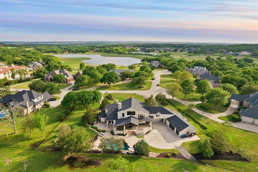 Guest house and views in the highly coveted ESTATES AT TOUR 18!  This magnificent 24-7 guarded and gated community offers a lifestyle of elegance and comfort. You'll step into luxury as you enter this well-built estate situated on a picturesque golf course. Relax by the fireplace and enjoy the sunrise or sunset in your outdoor living area. Unwind and enjoy quiet moments in the third-floor reading nook as you overlook the extraordinary family room below. Entertaining is effortless with a large kitchen with TWO DISHWASHERS and commercial grade range, plus a spacious game room upstairs, a dedicated media room, and an electric gated driveway for added convenience. The utility room off the kitchen features additional double ovens for a total of FOUR OVENS, ideal for parties, holiday cooking, and caterers. No detail has been overlooked in this home, including extra insulation and steel beam construction!  Served by award-winning Argyle ISD, and moments to Liberty Christian School and Coram Deo Academy.