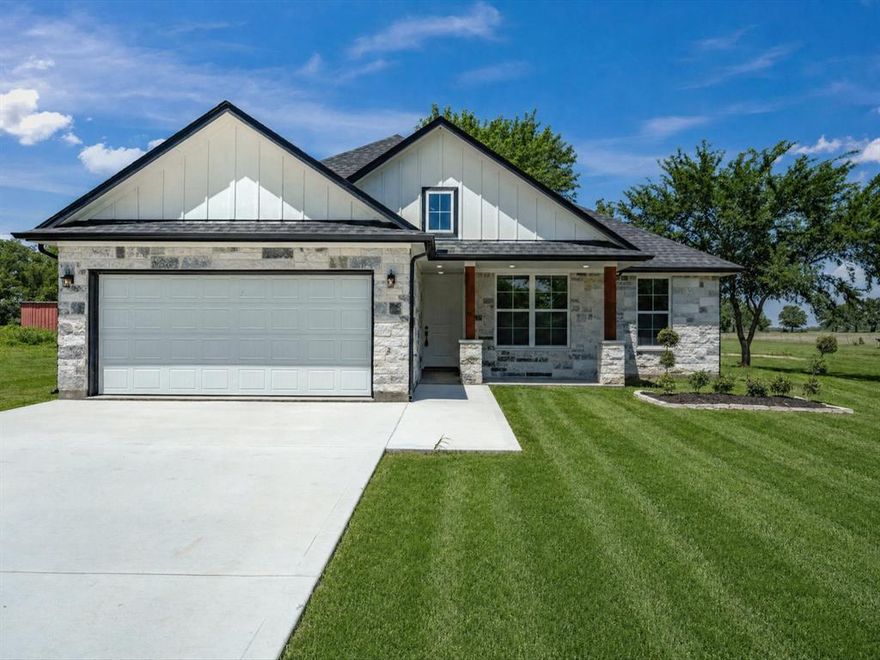 Experience the best of country living in this stunning 2026 new construction home situated on almost 5 acres behind a grand gated entrance. Designed with an open-concept layout, this home features beautiful wood-look ceramic tile throughout the main living areas and breathtaking country views from every angle. The spacious primary suite offers a spa-like retreat with stunning quartz finishes and a luxurious tiled shower. Outside, mature trees create a picturesque setting while livestock pens are already in place—perfect for hobby farming, FFA projects, or your own small ranch dreams. Enjoy the convenience of no dirt roads with easy access to town while still embracing peaceful rural living