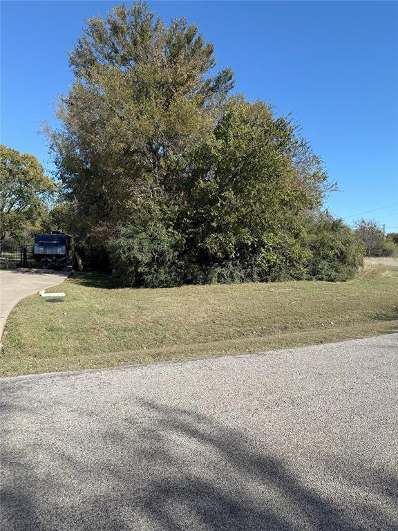 Locate a short two miles to the heart of Granbury, this beautifully wooded lot on Rockview Drive offers the perfect canvas for your dream home. Surrounded by mature trees and the tranquility of nature, this property provides a perfect location to Granbury's charming downtown, shopping, dining, and entertainment options.  Enjoy the natural beauty of this lot, ideal for creating a custom build that complements its lush surroundings. With utilities available and easy access to major roads, this is an excellent building site. Explore the possibilities of this lot in the Lakewood hills subdivision.