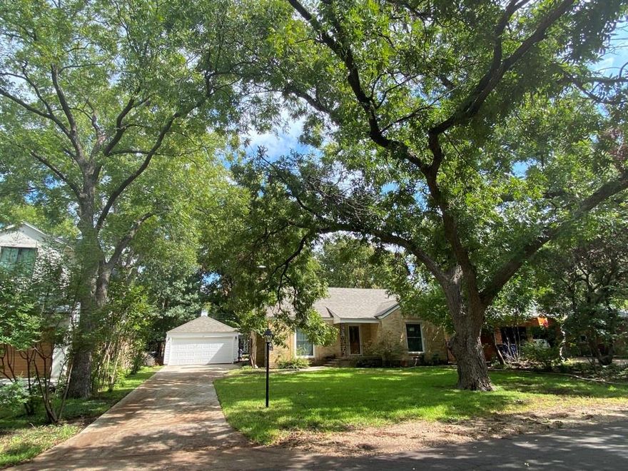 POWER LINES WILL BE BURIED!! Contract has been signed to bury power lines with scheduled completion in February 2024. Oversized lot on a highly sought after street. Adorable 3 bedroom, 2 bath home in Bluff View on Horseshoe Trail. Huge Trees provide lots of shade while you enjoy the landscaped backyard, screened in porch, greenhouse, and raised bed gardens. Dream 30 X 20 workshop in the backyard with garage door. Great location to move the kids closer to home, have a Dallas getaway, or start fresh and build a new home on this .35 acre lot. Close proximity to the Dallas North Tollway, restaurants, shopping, and downtown Dallas.