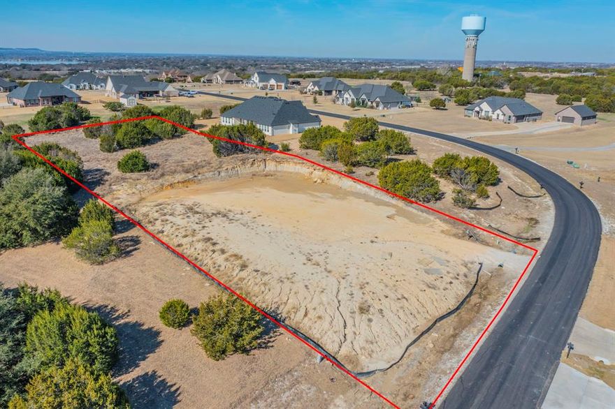 This over one acre homesite has already been cleared and leveled, with a culvert installed and a builder’s temporary power pole in place, making it ready for your dream home.

Located in the highly sought after Rolling Creek Ranch community, residents enjoy exceptional amenities including a secure gated entrance, two large bass stocked ponds, a community pavilion and park, and sports fields featuring a pickleball court.

Build with the freedom to choose your own builder and enjoy no mandatory construction timeline. A minimum home size of 1,800 square feet is required, helping preserve quality, consistency, and long term value throughout the neighborhood.

Conveniently located just a short drive from Granbury’s historic square, proudly known as the “Celebration Capital of Texas.”