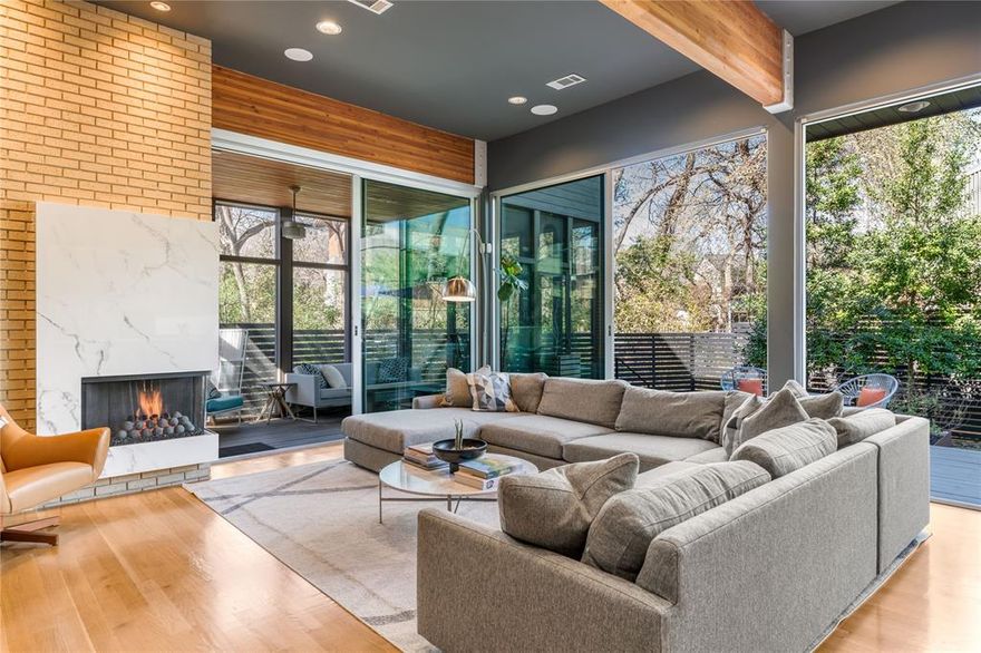 Located within the intimate gated community of Kessler Woods, this architecturally striking modern home blends clean design, natural light, and extensive upgrades in one of Dallas’ most coveted neighborhoods.

Expansive windows and custom Fleetwood sliders create seamless indoor-outdoor living. The open kitchen, dining, and living spaces flow to a screened porch, expansive deck, and a 2024 saltwater pool with custom glass tile and heat-chill system—offering both privacy and effortless entertaining.

The updated kitchen features white quartz countertops, instant hot water, premium cooking appliances, and a Sub-Zero wine refrigerator. The main level includes a guest bedroom and powder bath for flexibility and convenience.

Upstairs offers a dedicated study, two bedrooms connected by a Jack-and-Jill bath, and a spacious primary suite with treetop views, fireplace, and private veranda. The renovated primary bath includes a soaking tub, custom glass shower, heated towel rack, dual vanities, and a California Closets walk-in with marble counters.

Outdoor living is elevated with a leathered granite outdoor kitchen featuring a Coyote grill, Uline refrigerator, gas connection for a future fire feature, Sonance landscape speakers, mosquito misting system, and mature evergreen landscaping for year-round privacy.

Additional improvements include refinished white oak floors, full interior and exterior repainting, commercial-grade TPO roof, custom metal gutters, upgraded HVAC systems including a dedicated heat pump for the primary suite, and reinstalled windows with proper flashing.

Kessler Woods is known for its architect-designed homes, pocket parks, and gated privacy just minutes from Stevens Park Golf Course, Bishop Arts, Downtown, and Uptown. Modern architecture and thoughtful updates create a private retreat designed for both entertaining and everyday ease.