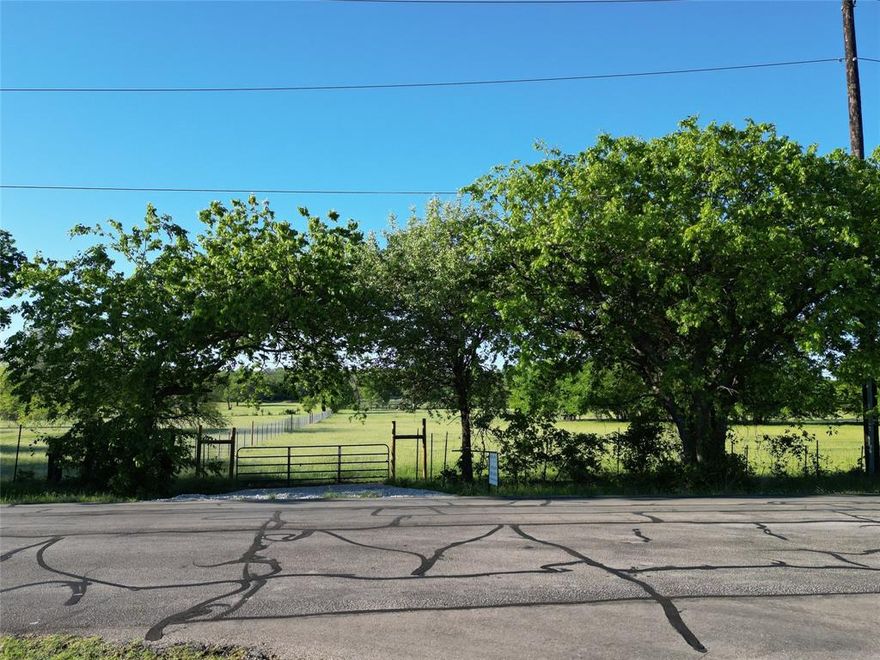 Discover a rare 7.36-acre luxury estate opportunity located in Bartonville, Texas with NO HOA! Located just one mile from Lantana Town Center and its shops, dining, and everyday conveniences. This ag-exempt, fully fenced tract offers the ideal setting for a private, gated estate with room for a grand main residence, guest house, pool, barn, or equestrian amenities. Bring your horses, livestock, or hobby-farm animals and enjoy the freedom and space this property provides. Bring your own builder and design the estate that reflects your vision.
Let your imagination run wild—whether you’re planning a statement-making residence, a purpose-built equestrian layout, or a multi-generational living arrangement with thoughtfully designed guest accommodations. Multiple prime building sites allow you to tailor the land to your lifestyle, from expansive outdoor living to functional accessory structures.
This property also presents a compelling buy-and-hold investment opportunity, with the agricultural exemption offering exceptionally low carrying costs while the area continues to grow in demand and value.
Enjoy the privacy and openness of true acreage living while staying close to the suburban conveniences that make this location so desirable. Situated within Denton ISD, the property offers a blend of seclusion, accessibility, and long-term appeal. Electric and Cross Timbers Water are available at the road; septic required.
Large parcels this close to Lantana amenities are exceptionally rare. Whether your vision leans toward luxury living, equestrian use, multi-generational flexibility, or a strategic land investment, this property provides the setting and versatility to bring it to life.