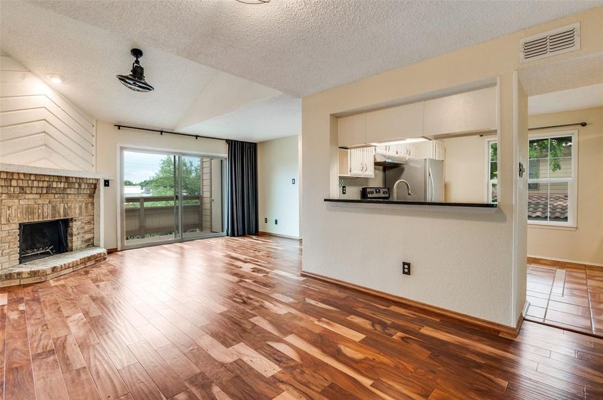Beautiful one bedroom, one and a half bath unit in the exceptional gated community of Inwood Crossroads. Step inside unit 5K to find a light filled, open floorplan with a cozy fireplace, spacious living and dining areas, half bath, and open kitchen with white cabinetry, granite countertops and stainless steel appliances. Walk through the sliding glass door to your own covered private patio with ample storage closet. Upstairs is the spacious primary bedroom with a walk in closet, and private ensuite bath. This complex offers a community pool, spa, and clubhouse, and is situated directly across from Inwood Village offering walkability to Trader Joes, Inwood Theatre, shopping, charming restaurants and eateries, and much more! Further conveniences include gated access with security code, one covered parking space, plus additional parking for guests. The complex's central location is key with quick access to Dallas North Tollway, Love Field, Park Cities, and downtown Dallas, and north Dallas. Enjoy urban lifestyle in one of best locations Dallas has to offer!