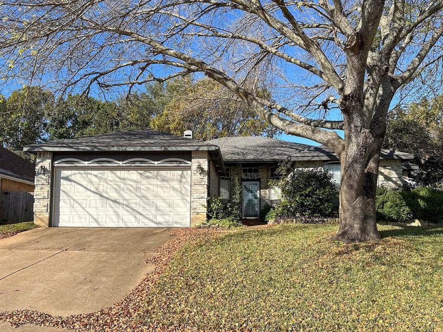 Beautiful, clean and well maintained 3-bed, 2-bath home with new carpet and LVP flooring. Fresh paint and large windows, vaulted ceilings, lots of natural light, and a cozy fireplace. This layout also gives you two dining areas or a great flex space. The oversized primary suite is a true retreat with two walk-in closets, a double vanity, and a relaxing garden tub. Outside, enjoy a shady back patio and a large storage building for all your extras. The 2-car garage includes built-in cabinets for even more storage. In a convenient Arlington location close to parks, schools, and major highways, this home delivers comfort, updates, and charm.