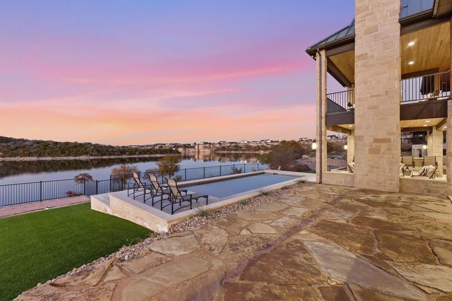 Incredible lakefront retreat with front row panoramic views of iconic Hells Gate and a brand new pool added in 2025 that takes the outdoor experience to the next level. This waterfront property also offers a rare opportunity to transfer a 16x40 boat slip at Bluff Creek Marina making lake days easy and convenient.

Designed for both comfort and entertaining this home features two spacious primary suites on the main level along with a stunning kitchen and a massive family room all positioned to capture beautiful lake views. Each of the six bedrooms includes its own private en suite bathroom offering space and privacy for family and guests alike.

The lower level is built for fun with a large game room a huge wet bar and a balcony overlooking the water. A private guest suite with its own bathroom sits above the garage making it perfect for visitors or additional rental flexibility. Step outside to enjoy the outdoor kitchen and fireplace ideal for cool evenings and long conversations after sunset. The newly added pool creates a resort style backyard where you can relax swim and take in the scenery.

This home is being sold fully furnished and is currently operating as a successful short-term rental making it an excellent investment opportunity or turnkey lake getaway. Located in Sportsman's World residents enjoy access to a marina live outdoor music venue general store and grill tennis courts community pool covered pavilion and playground.

Whether you are looking for a personal retreat an income producing property or both this home delivers. Settle in and start planning your Fourth of July celebrations with what may be the best fireworks view on the lake.