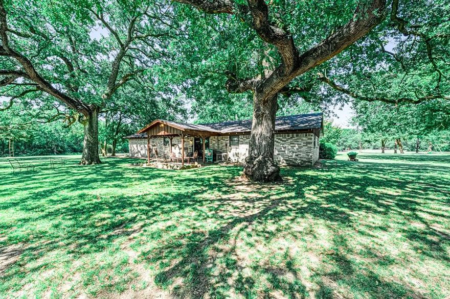Welcome to a rare and remarkable opportunity to own a true Texas treasure. This 3 bedroom, 2 bathroom ranch style home sits at 1,556 square feet and is nestled among majestic 300+ year-old oak trees on a stunning 178 + - acre property — the perfect blend of peaceful seclusion and working functionality.

As you approach, you're greeted by classic white pipe fencing that frames the private drive leading to the home, which sits tucked back from the road for added tranquility and privacy. The land is ag-exempt and fully equipped for livestock, featuring a barn and working stalls ready for running cattle or creating your own ranching legacy.

Whether you're looking to farm, ranch, or simply relax beneath the canopy of ancient oaks, this one owner property offers unlimited potential. Located just 60 miles east of Dallas, it’s an easy escape from the city while still being close enough for convenience.

Don't miss your chance to own a piece of Texas heritage — this land tells a story, and now it’s ready for its next chapter.