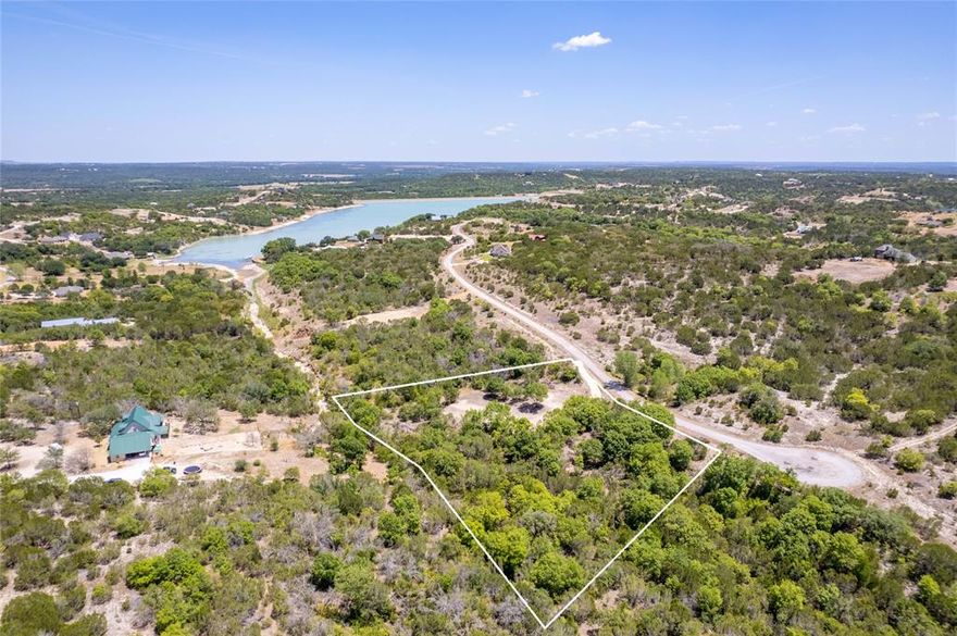 Fantastic opportunity to purchase this scenic 2.45+ acres located near a cul-de-sac and convenient to the community pool, play park, dock, and boat ramp for Beacon Lake.  This property offers a driveway and cleared area that is ready for you to start building your home. You will enjoy an abundance of trees, as well as a meandering seasonal creek that roams through the property and gives much character to the land and brings in the wildlife.  This property provides plenty of elbow room and areas to explore. The amenities that Mountain Lakes Ranch offers are sure to please, such as a community pool, club house, play park, exercise park, gardening opportunities, RV parking, and camping area.  Convenient to the metroplex, as well as Stephenville, Granbury, Weatherford, and Glen Rose.  Come enjoy Bluff Dale, TX.