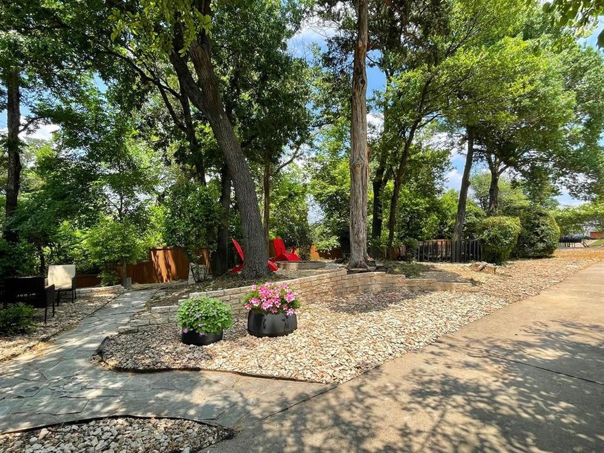 OFFERING $10,000 towards closing cost or rate buy-down. SMART Home! Rare updated Mid-Century Modern with chic contemporary touches in desirable Kessler Park. This stunning residence offers 3 bedrooms, 3.5 baths, plus a versatile 4th flex room that can serve as a bedroom or private office. Enjoy a pool with multiple outdoor living spaces on an oversized, tree-filled lot. Relax in backyard seating areas or on the balcony overlooking the pool and mature landscaping. Inside, the open concept design highlights a spacious living room with serene views of the backyard oasis. A wraparound balcony connects to multiple bedrooms, creating seamless indoor-outdoor living. The chef’s kitchen boasts custom cabinetry, granite countertops, a large island with wine cooler, and opens to the family room—perfect for entertaining.Nestled on a deep, private lot with lush greenery, the home features a gated backyard, 2-car garage, and covered carport. A private guest quarter on the ground floor with its own entrance and full kitchen provides flexibility—ideal for multigenerational living or income potential. Don’t miss the upstairs turret room, an inspiring space with 360° views of the surrounding treetops—perfect for an artist’s studio or private office. All of this comes with easy access to major highways, Downtown Dallas, and the city’s best dining and entertainment.